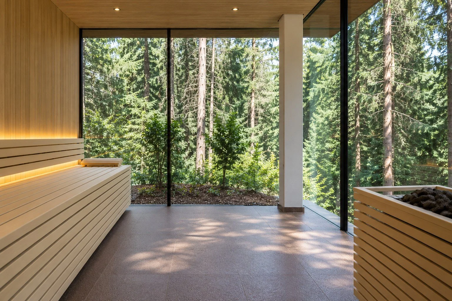 Forest Spa sauna at Saltus with pale wooden benches and floor-to-ceiling windows onto the spruce forest