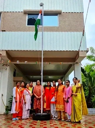 Indian teachers gathered together outside the building to celebrate independence day.