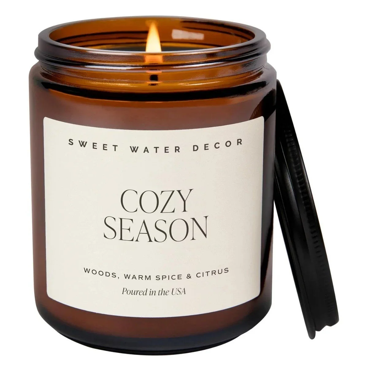 Sweet Water Decor Cozy Season candle in an amber glass jar