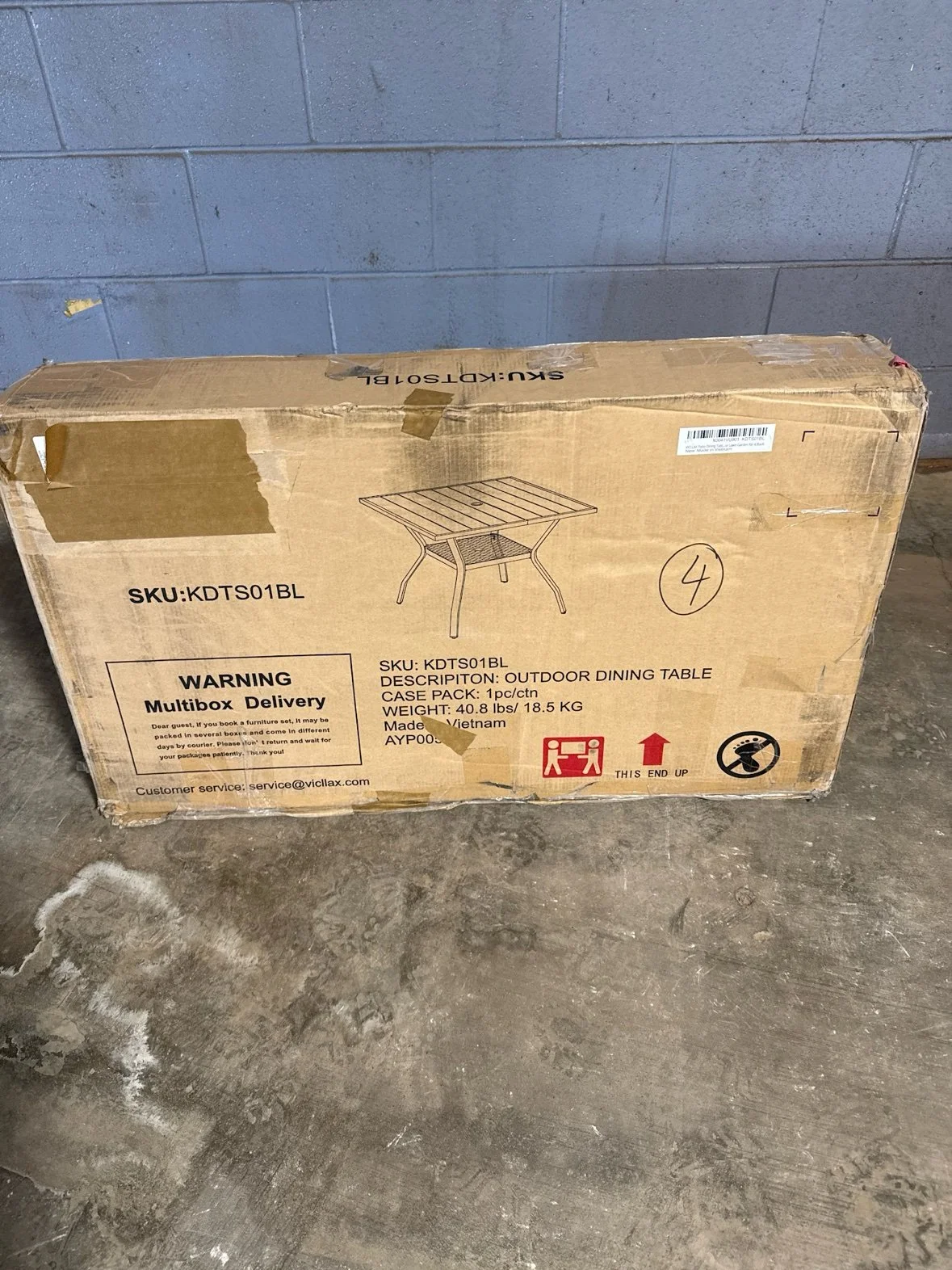 vicllax 37.8" Black Square Outdoor Patio Dining Table for 4 With All-Weather Metal Frame in its box at our Sylvania Bargain Bin warehouse