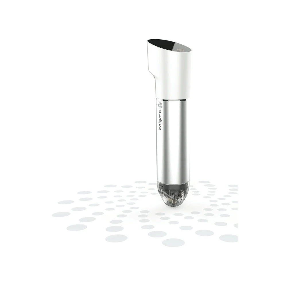White and stainless steel immersion circulator sous vide cooker floating above a dotted surface