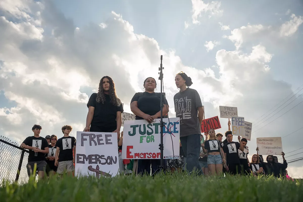 Emerson Colindres' sister (left), mother (middle) and an interpreter (right) address the crowd of protesters outside the Butler County Jail. Photo: Ryon Tunstull