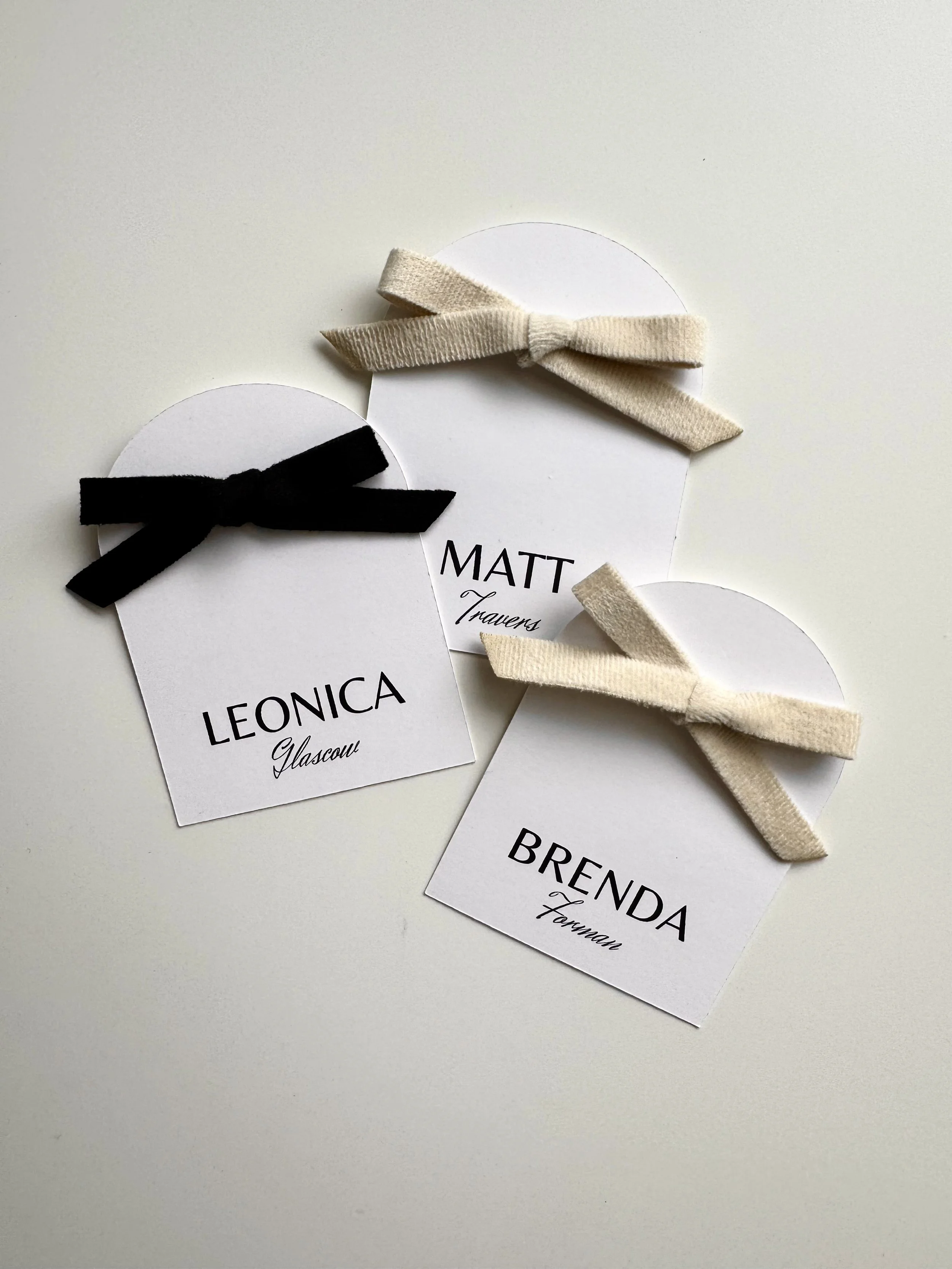 arched escort cards ribbon