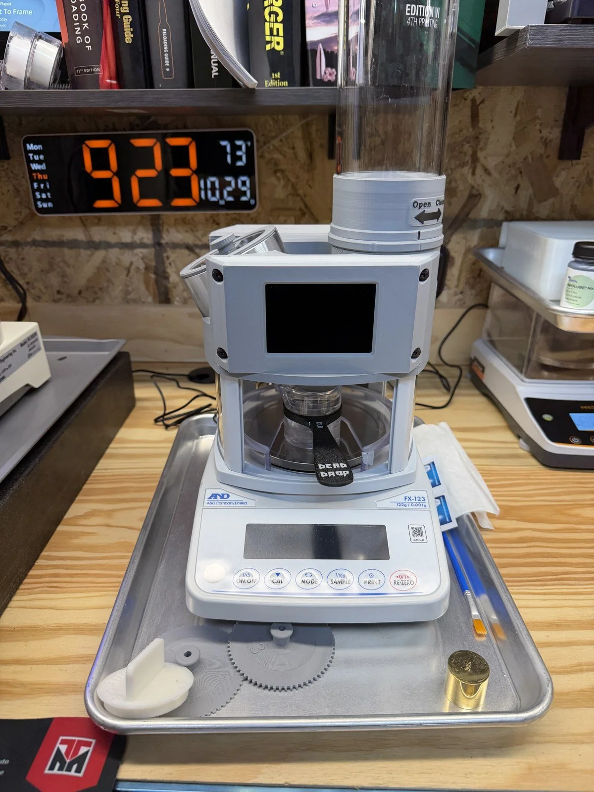 Meehl Solutions trickler on an A&D FX-123 balance