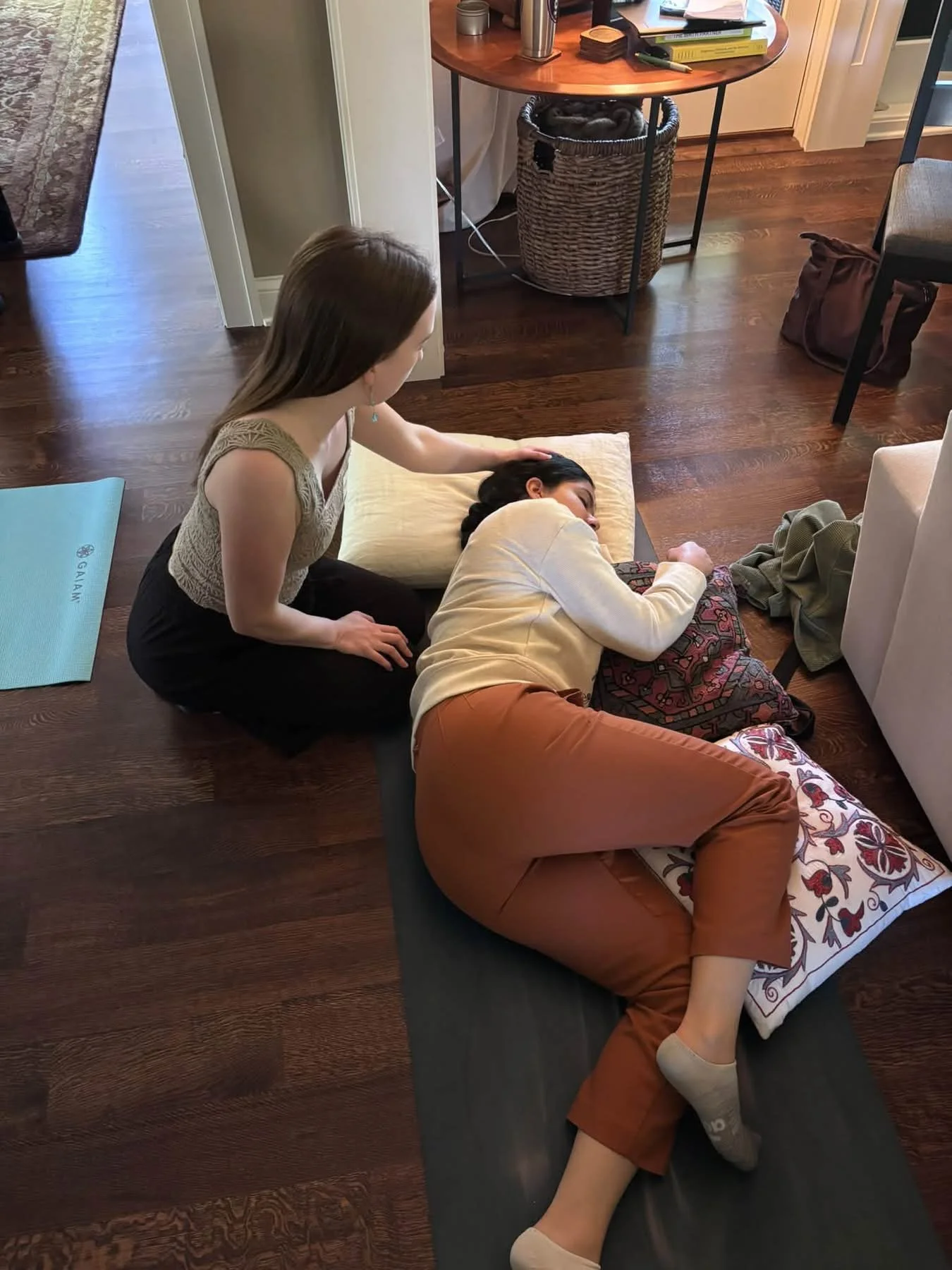 A doula supporting a pregnant person through relaxation and other comfort measures to cope with pain from labor.