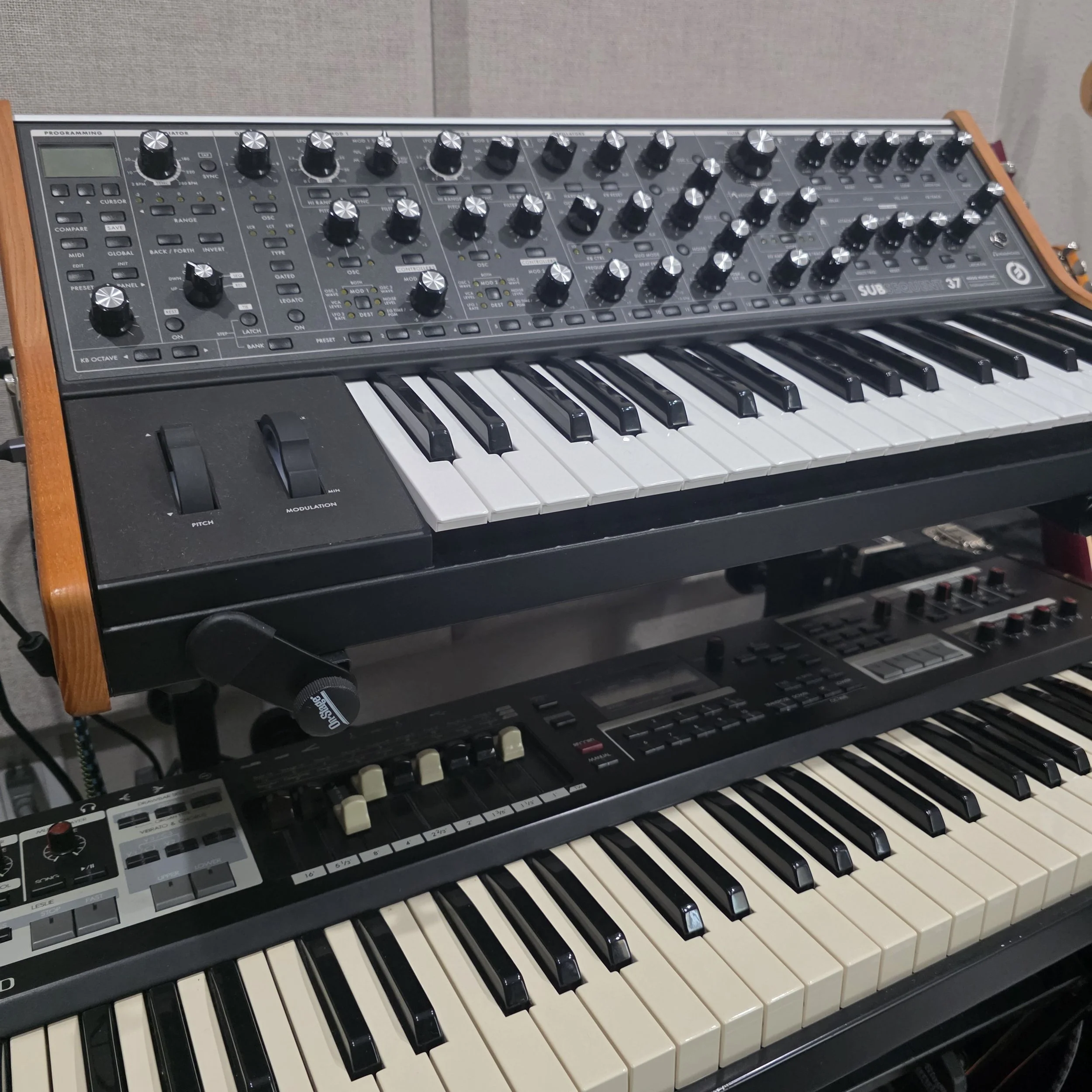 Keyboard rack with a Korg and Moog 