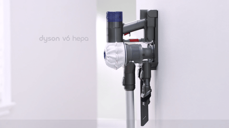 Dyson V6 HEPA cordless stick vacuum mounted on a wall