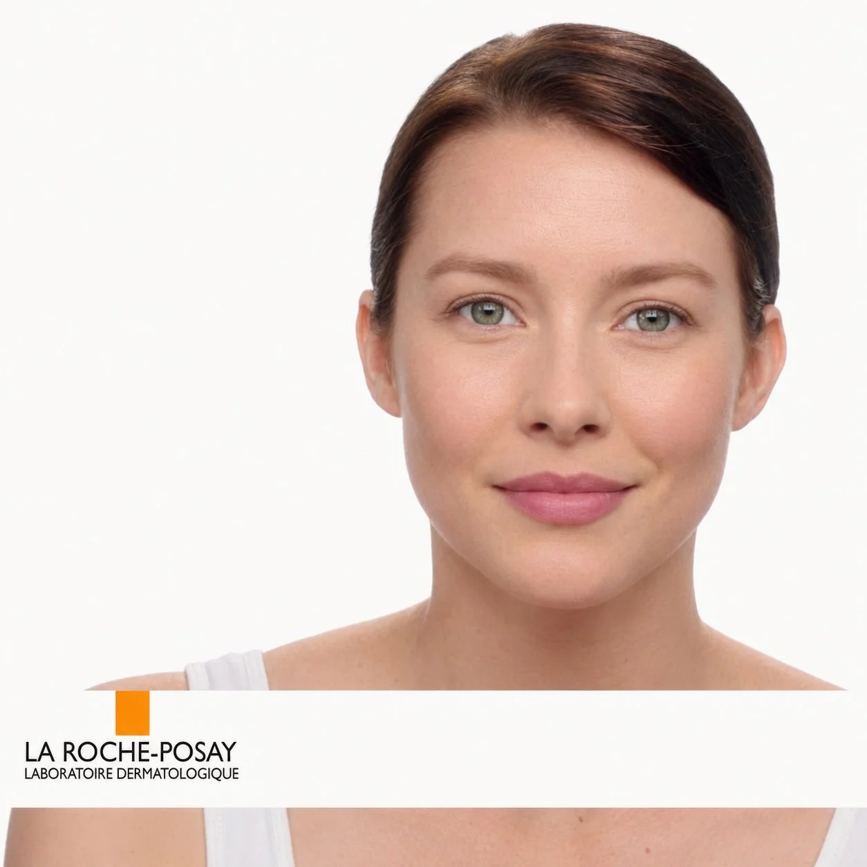Close-up portrait of a woman with clear skin and La Roche-Posay skincare logo