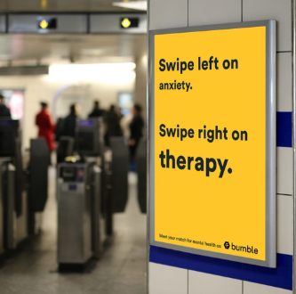 Bumble advertisement in a subway station reading “Swipe left on anxiety. Swipe right on therapy.”