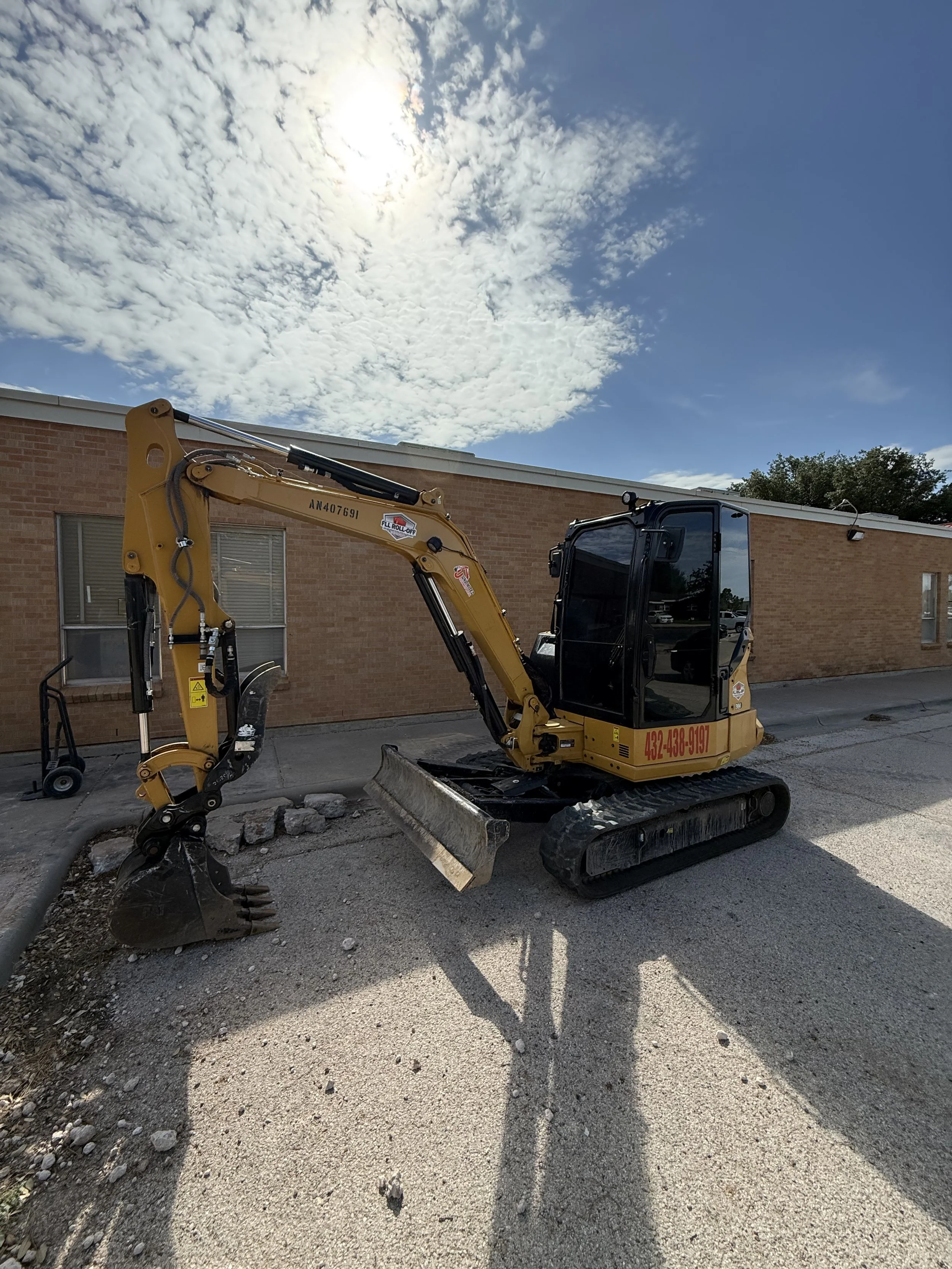 tracked mini excavator at a school construction