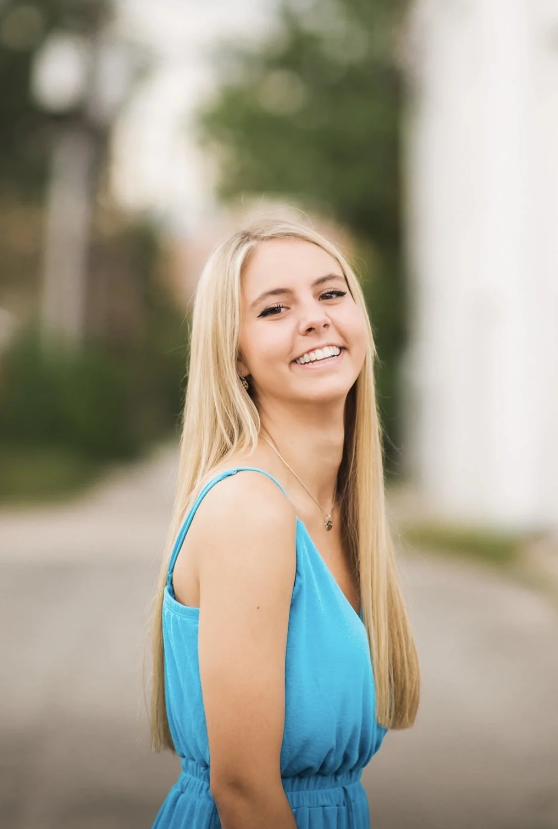 Girl smiling in blue dress