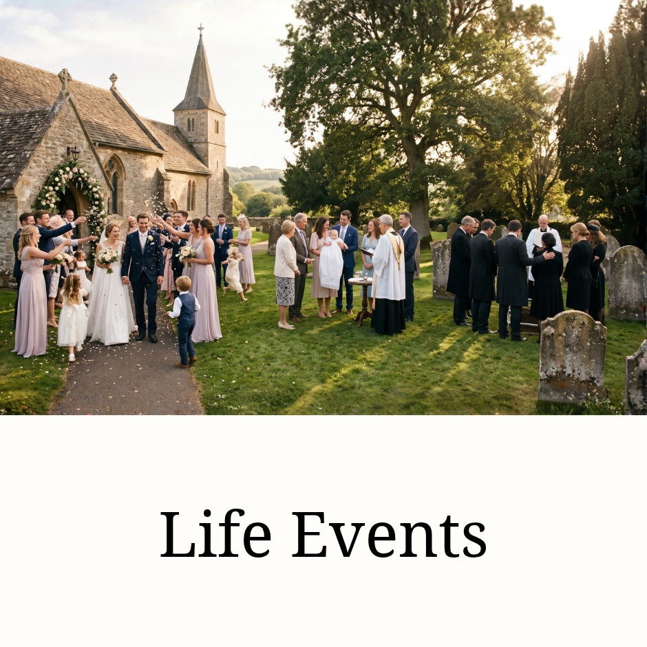 Wedding party gathered outside a historic stone church in a picturesque village cemetery