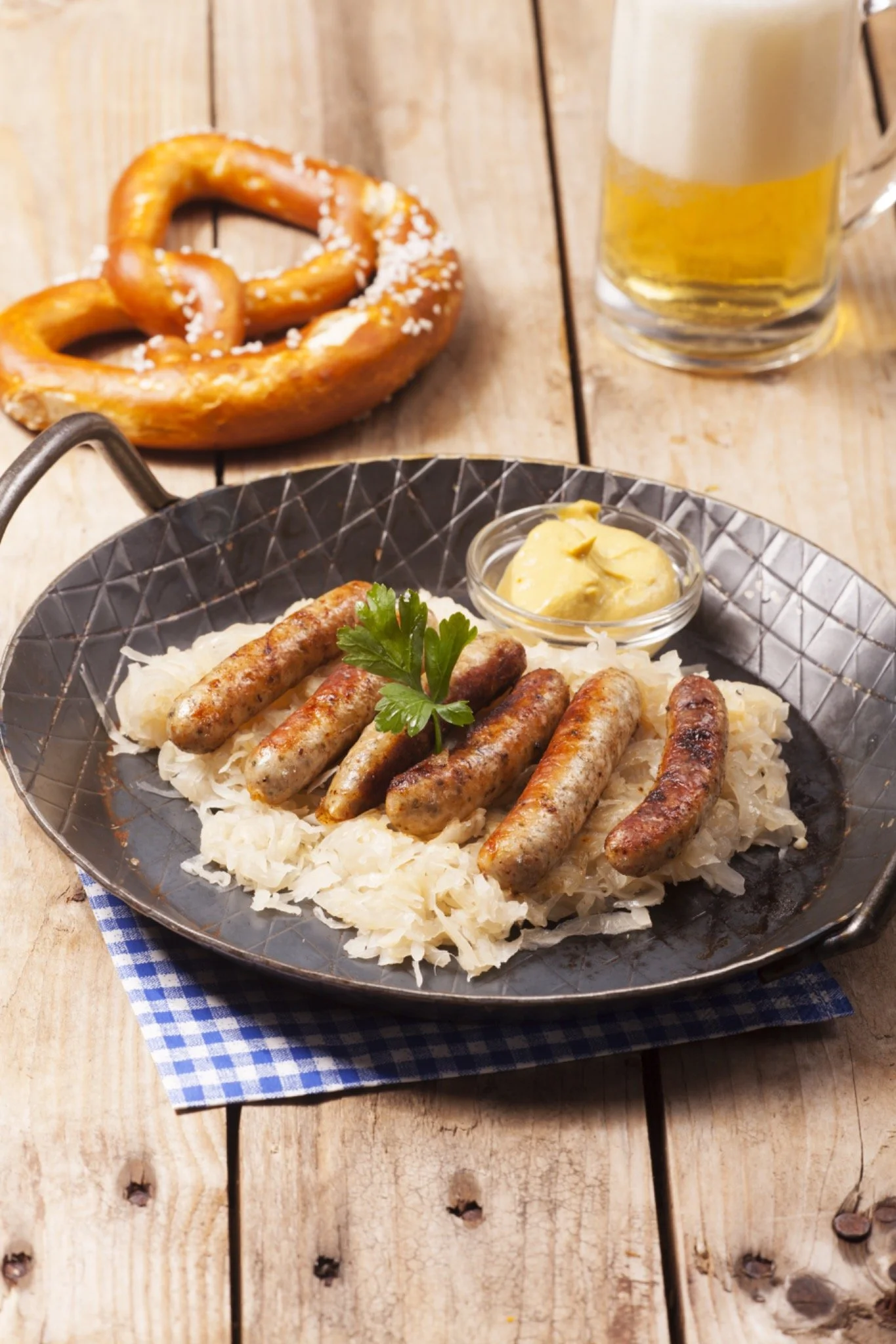 Nuremberg bratwurst served with sauerkraut, mustard and a pretzel