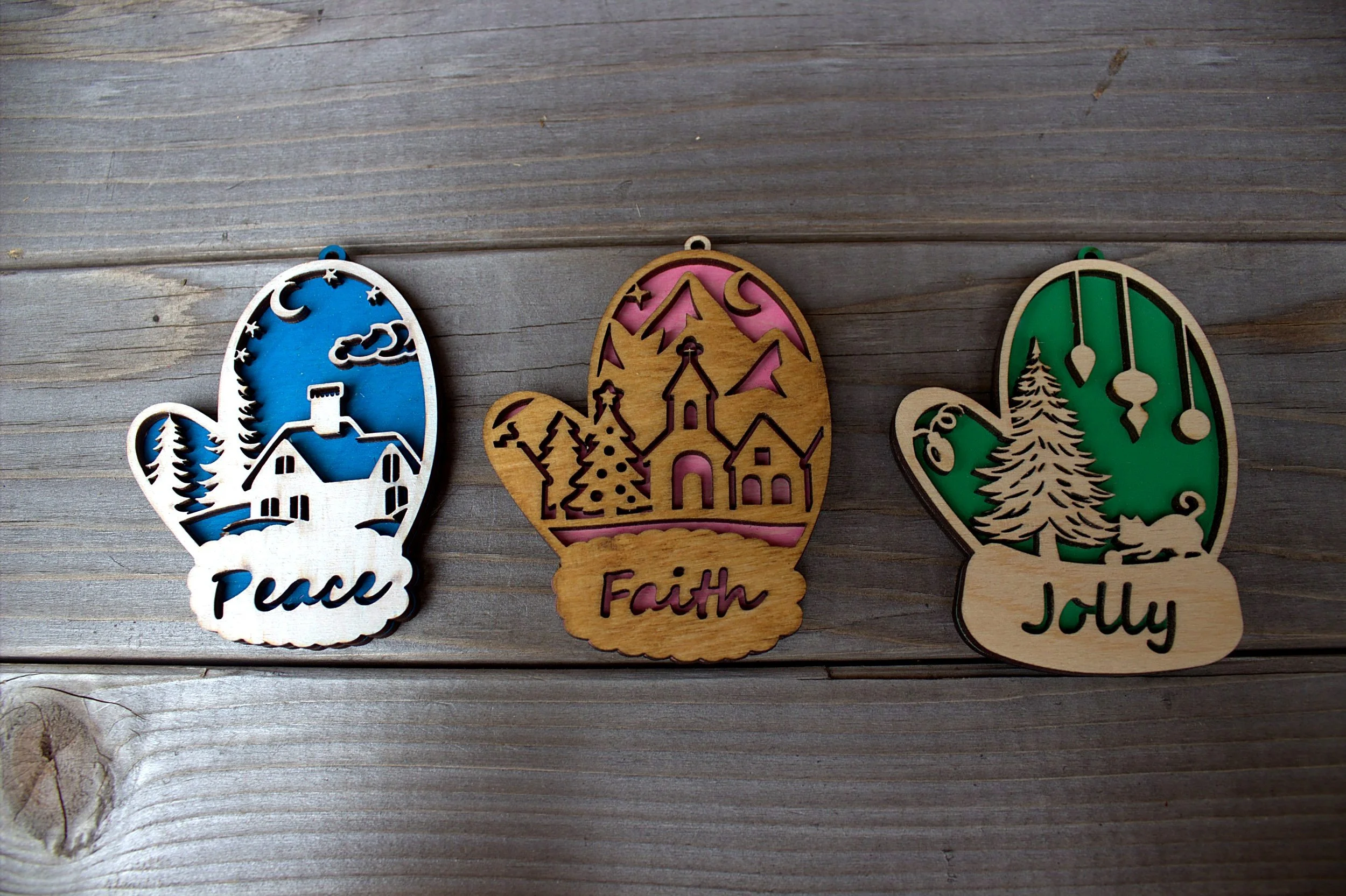 Laser-cut mitten ornaments — Peace, Faith, and Jolly designs