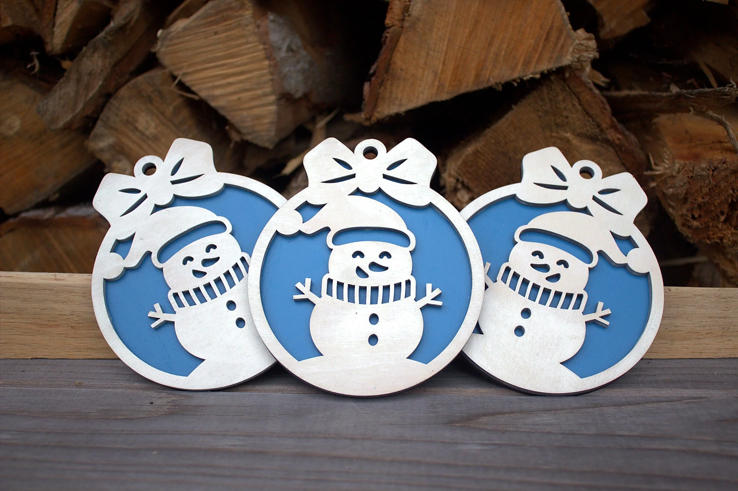 Laser-cut snowman ornaments