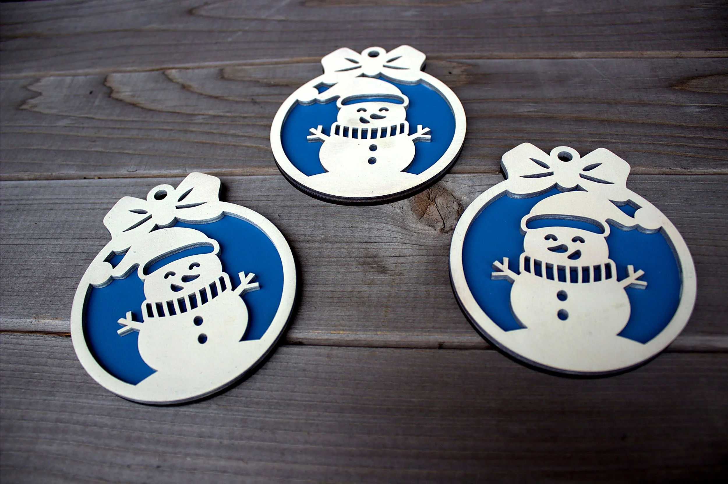 Laser-cut snowman ornaments