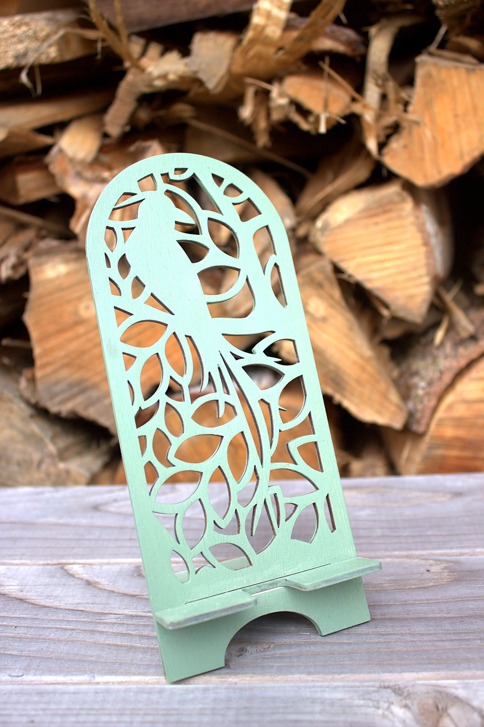 Laser-cut phone stand — raven design