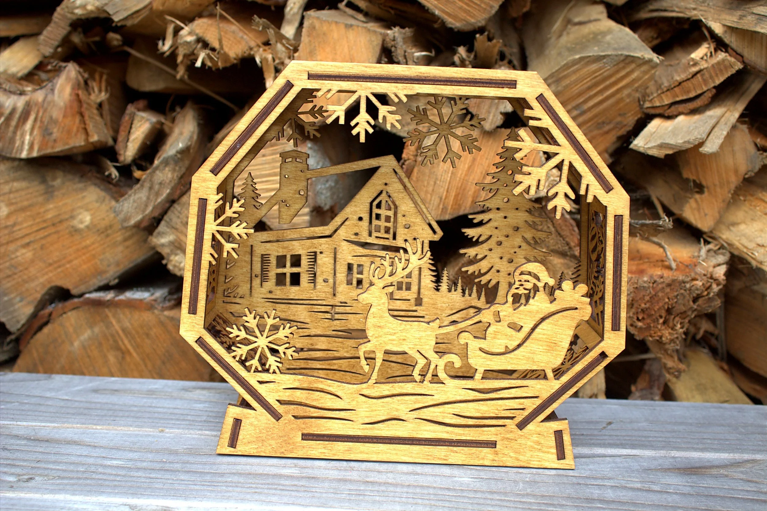 Laser-cut octagonal winter lantern — Santa and reindeer scene