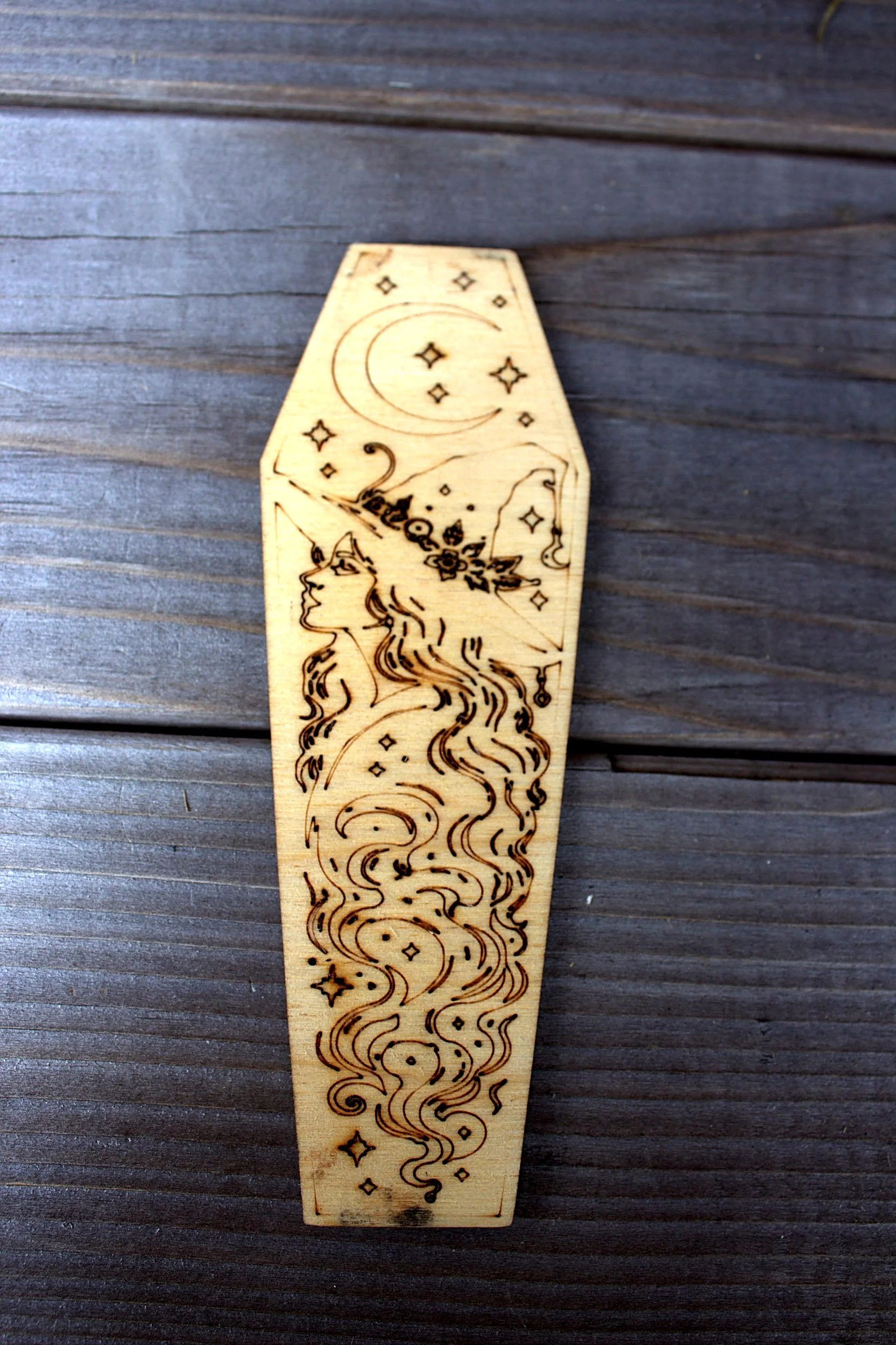 Laser-engraved coffin-shaped bookmark — celestial swirl design