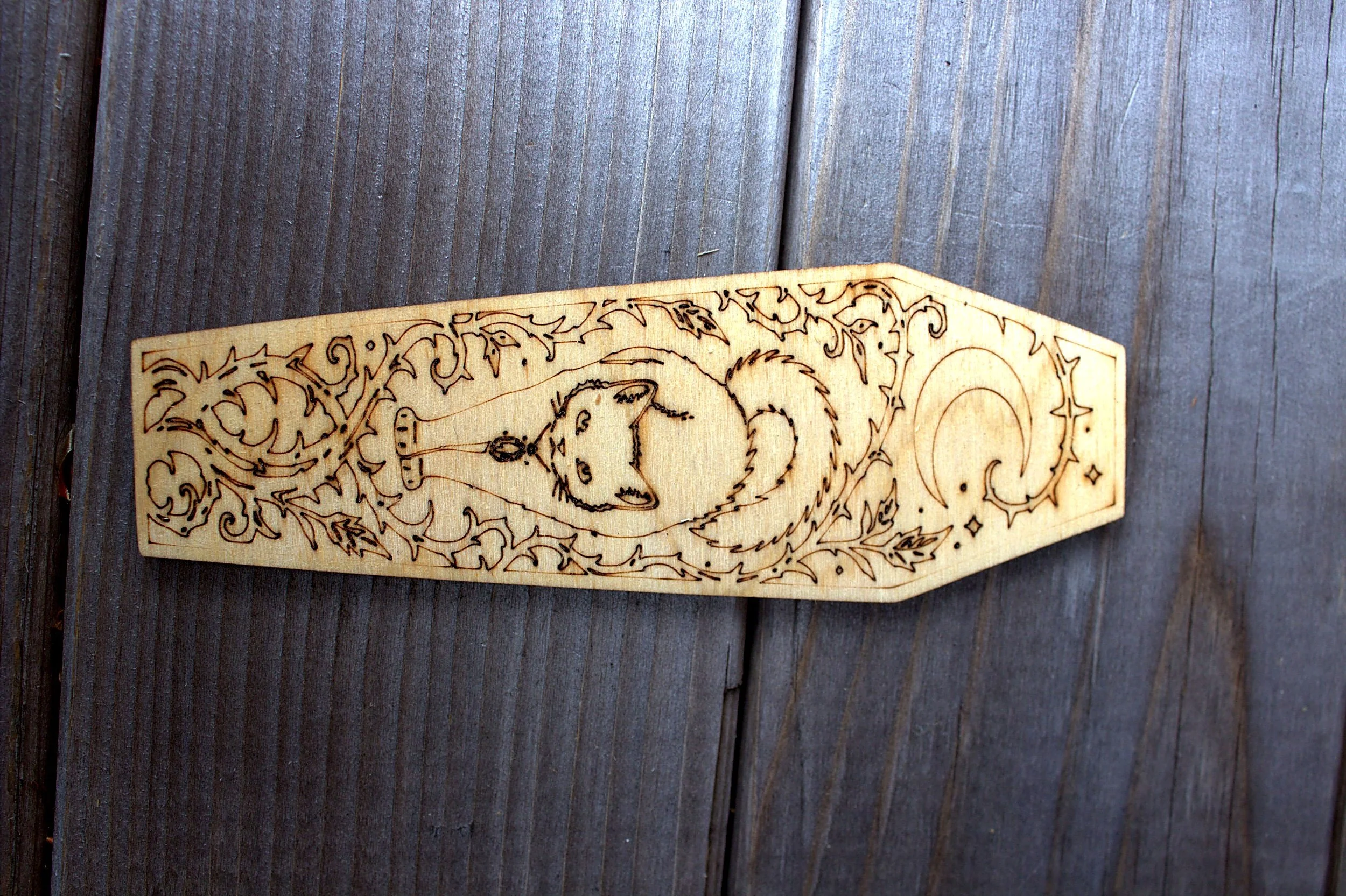 Laser-engraved coffin-shaped bookmark — cat design