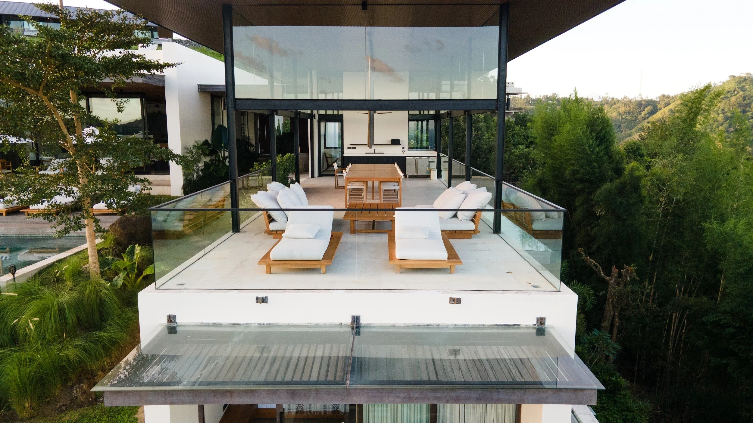 Sun deck with loungers on the open-air terrace at Villa Kai Lani, South Lombok