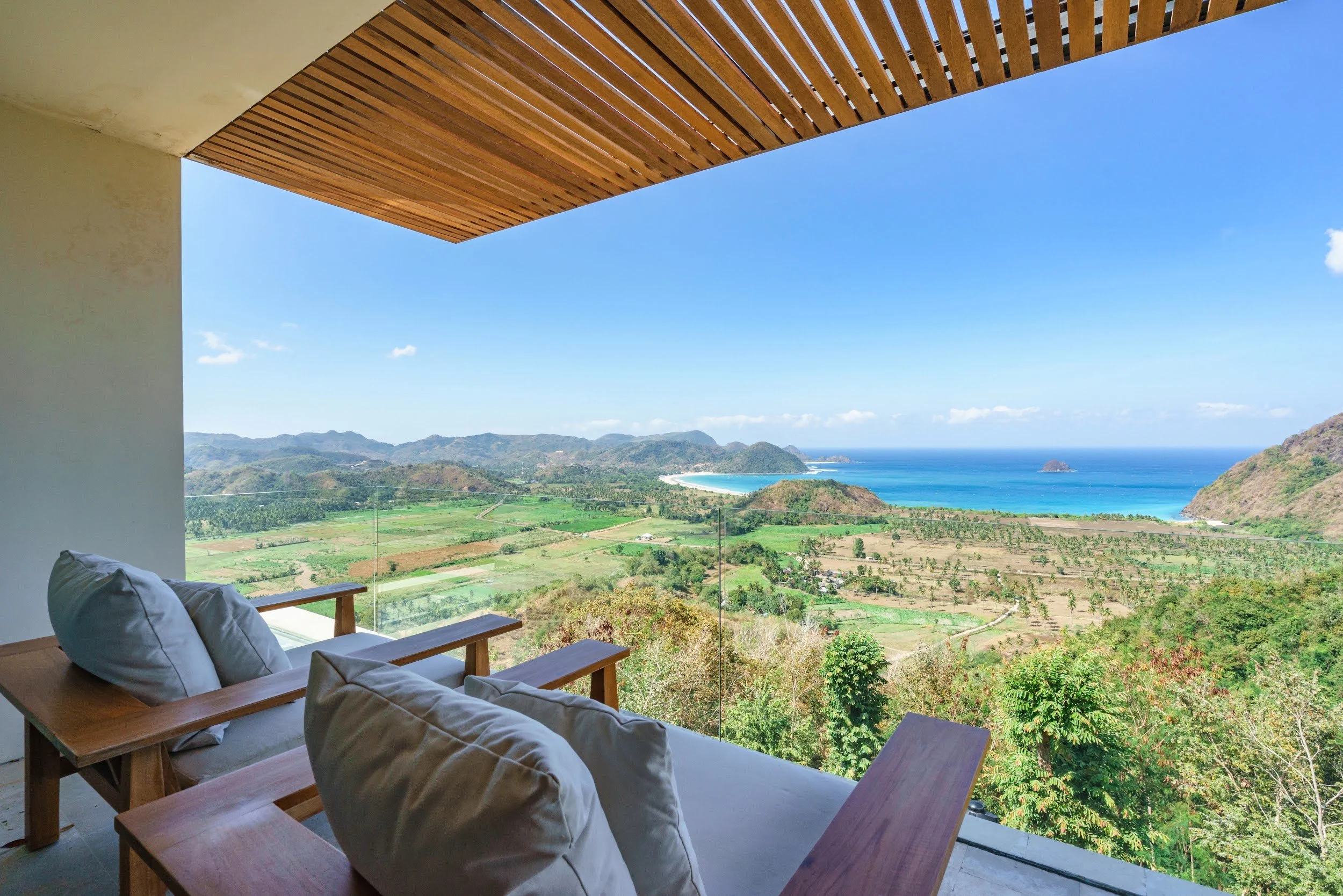 View over the hills to Selong Belanak Bay from the primary suite terrace at Villa Kai Lani