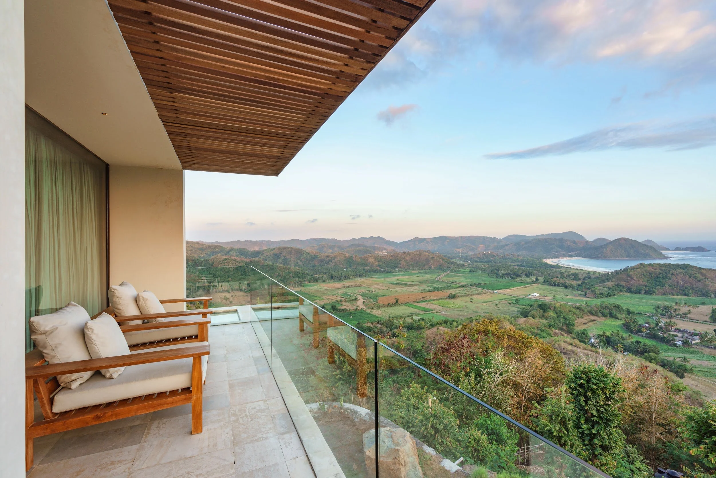 Primary suite balcony at Villa Kai Lani overlooking the hills and Selong Belanak Bay