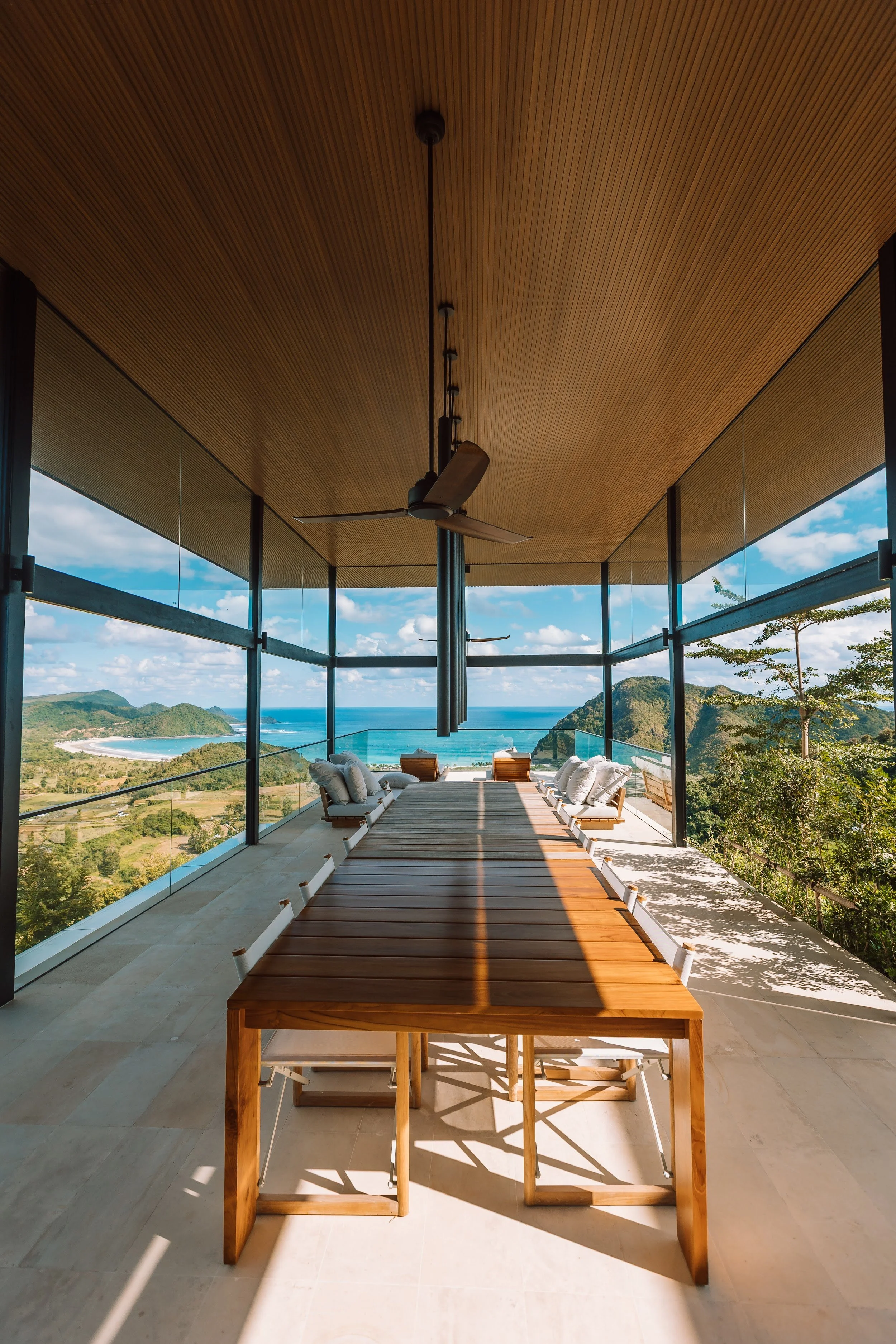 Outdoor dining. The open-air pavilion sits above the turquoise water, with views all the way to the horizon. It's the perfect setting for a meal from your private chef, a relaxed barbecue or sunset cocktails.