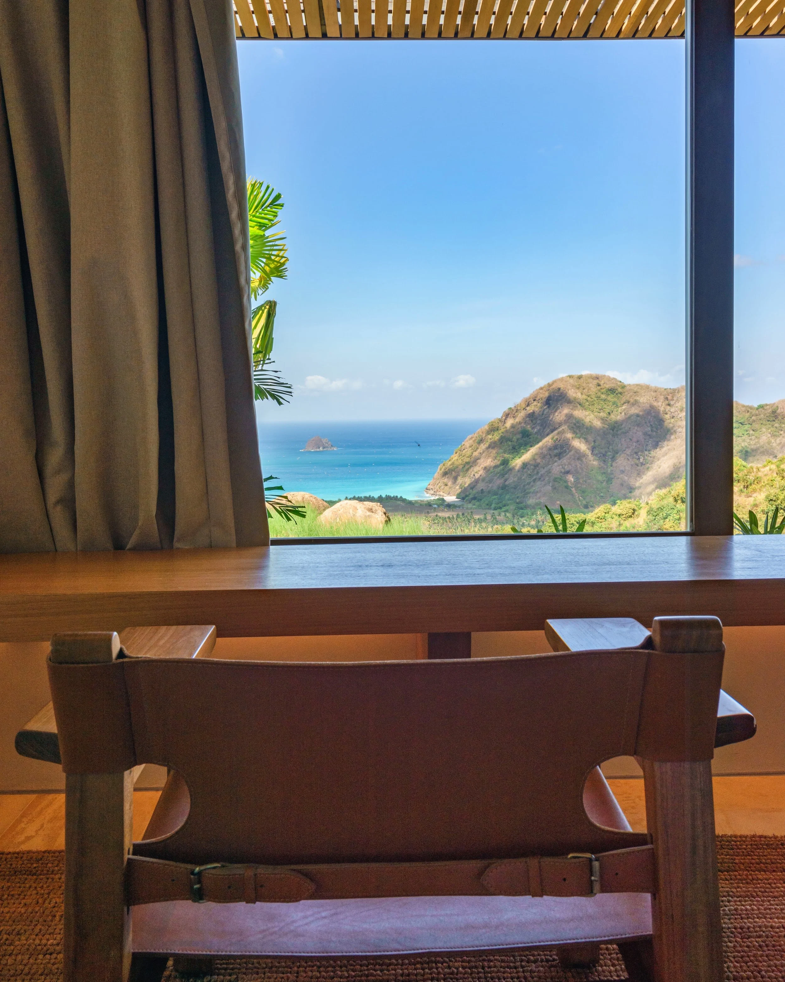 View of the green hills and sea from Bedroom 3 at Villa Kai Lani, Selong Belanak