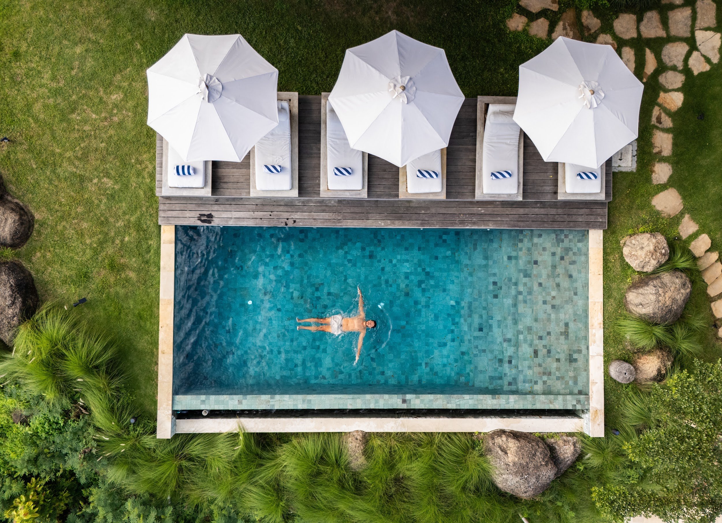The pool. The private pool is lined with sun loungers and looks out across Selong Belanak Bay.