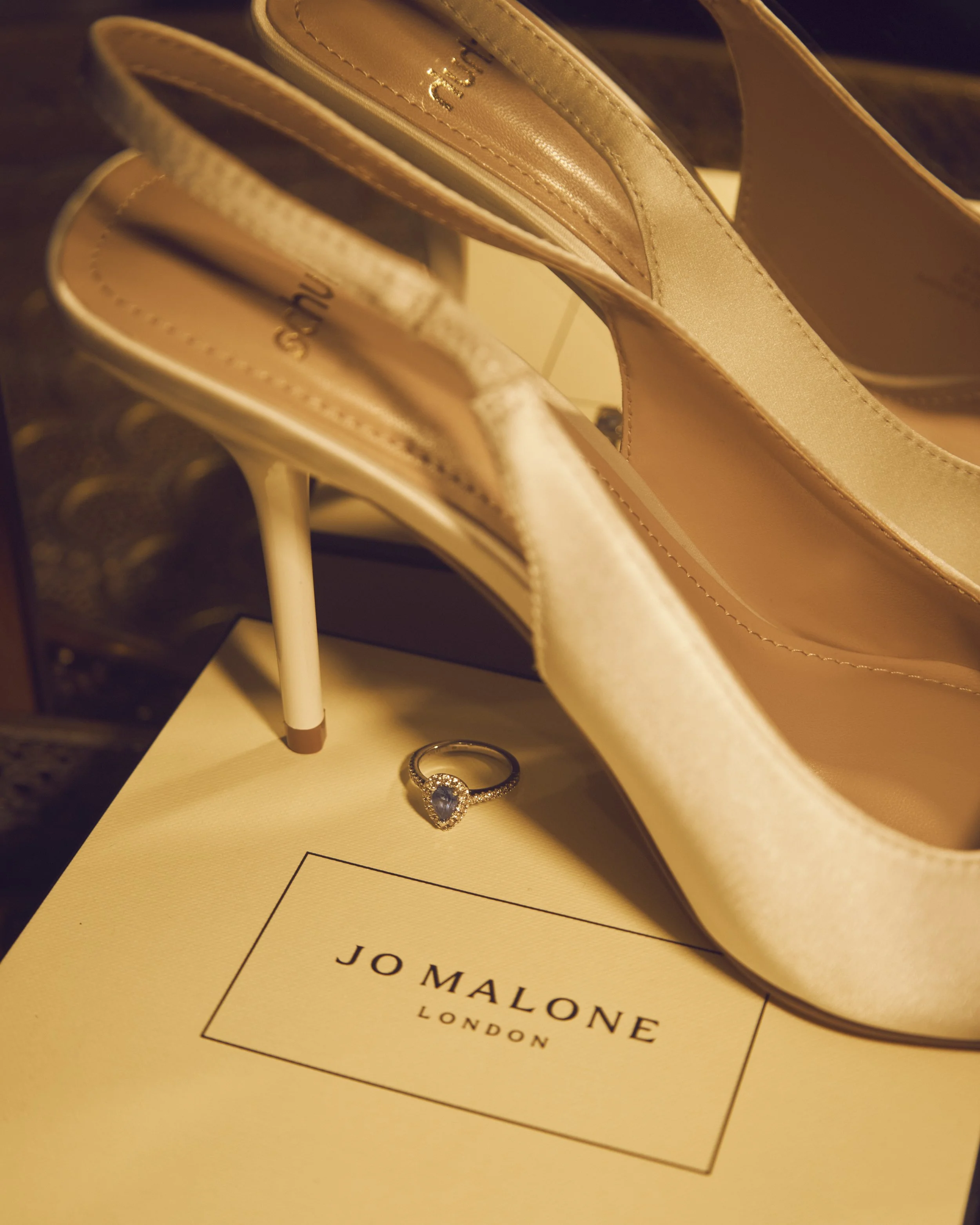 Wedding bridal detail photograph showcasing the bride’s accessories and finishing touches, captured by London wedding photographer Ade West.