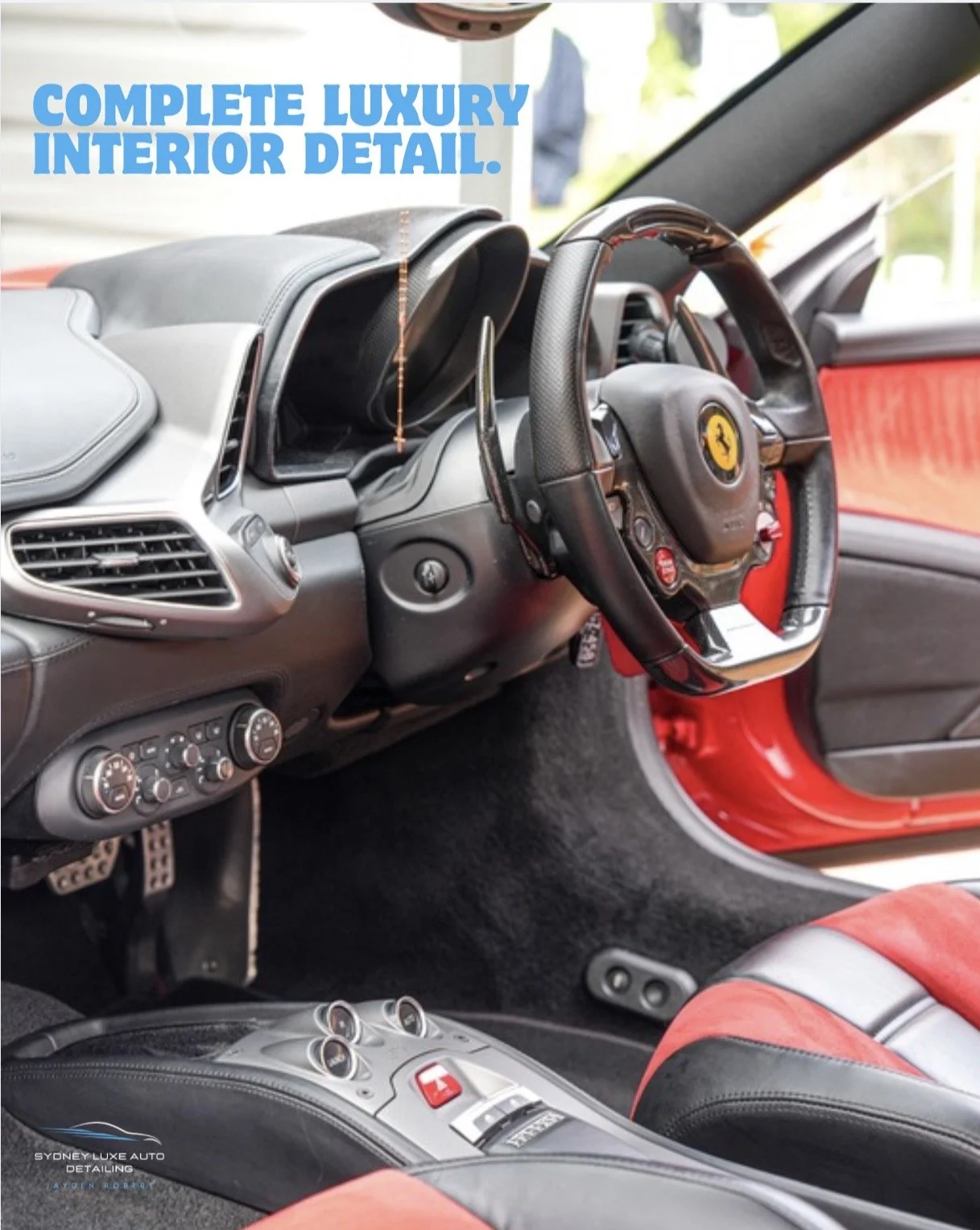 Luxury Ferrari interior with leather dashboard, steering wheel, red seats, and center console