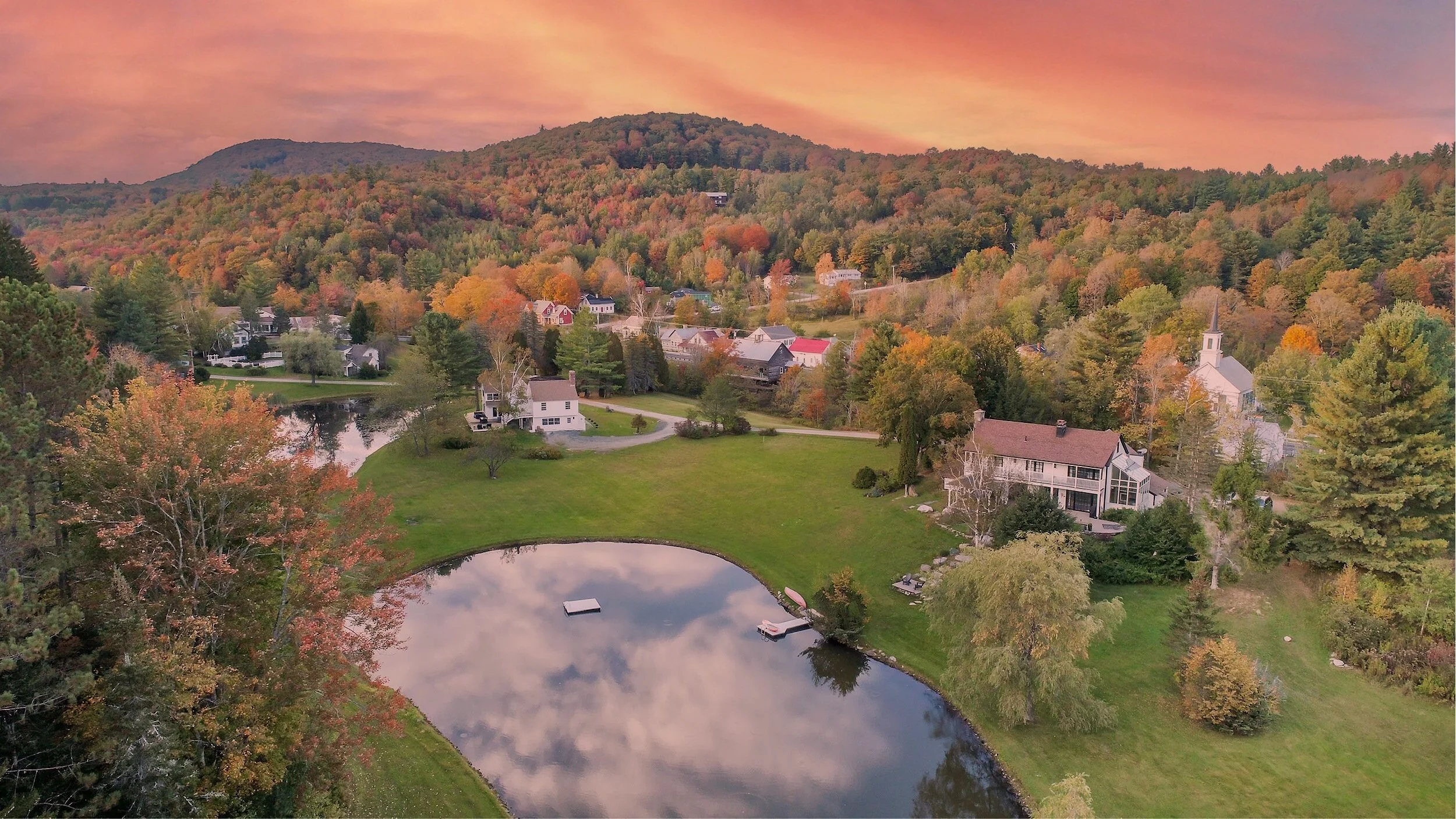 Farm Road in Southern Vermont at sunset, with ponds, accommodations, and autumn foliage