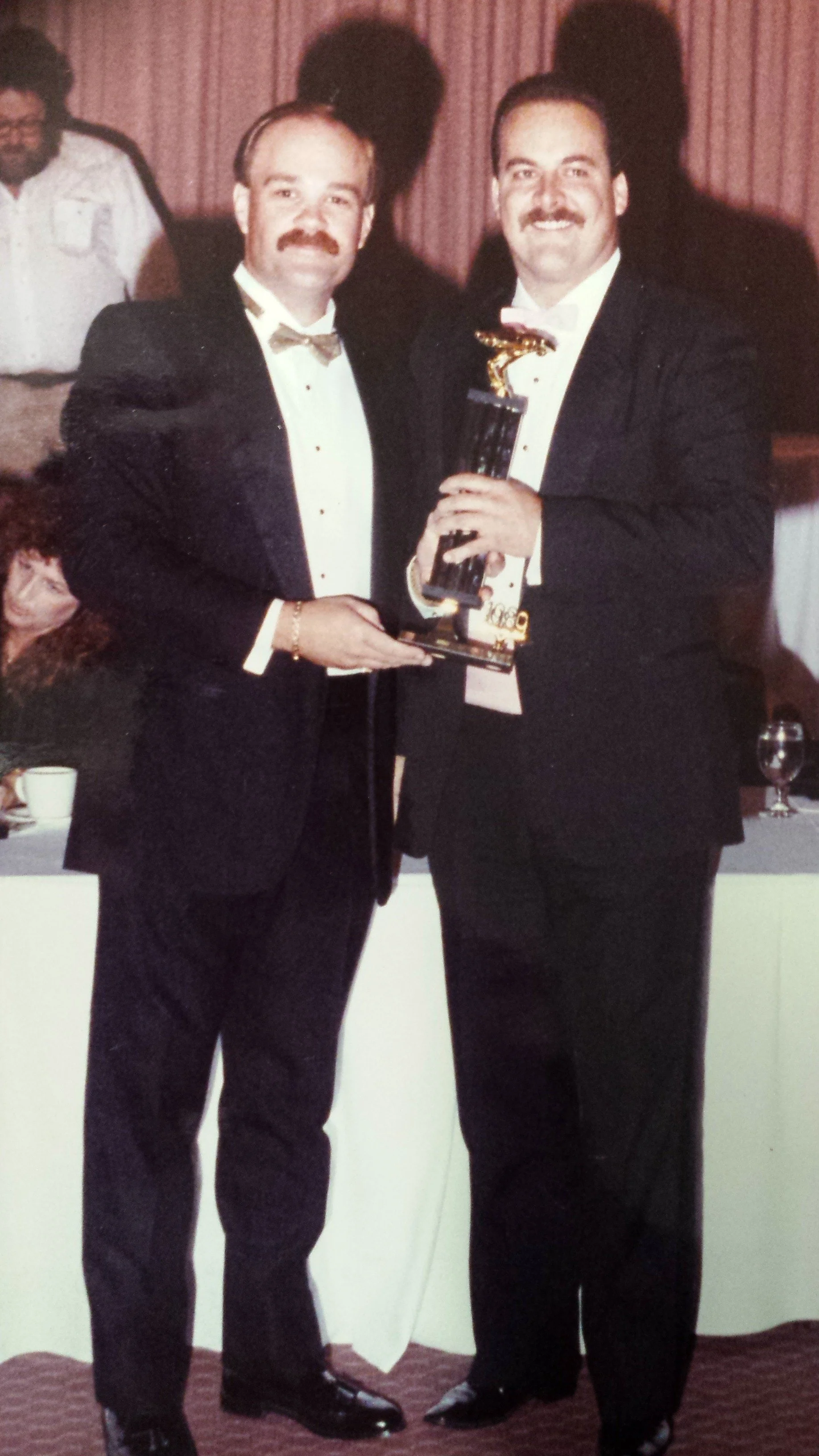 Ray Wilkins presents NASCAR Rookie of the year honors to driver Rick Crow 1989