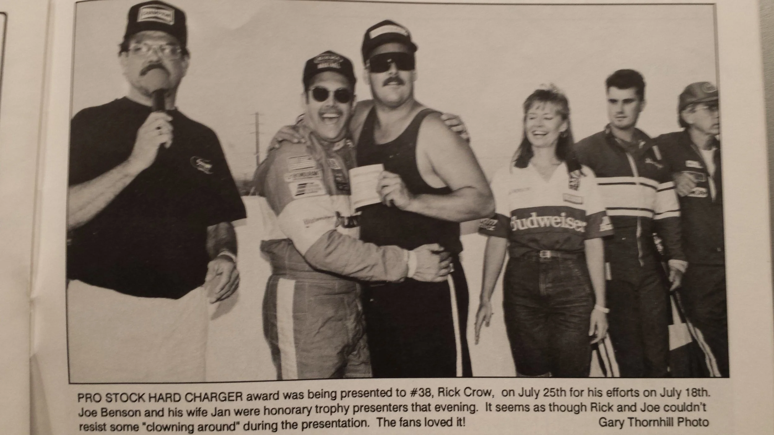 NASCAR Late Model driver Rick Crow takes the win and receives his check from honorary presenters Los Angeles KLOS Disc Jockey Joe Benson and Jan Benson.