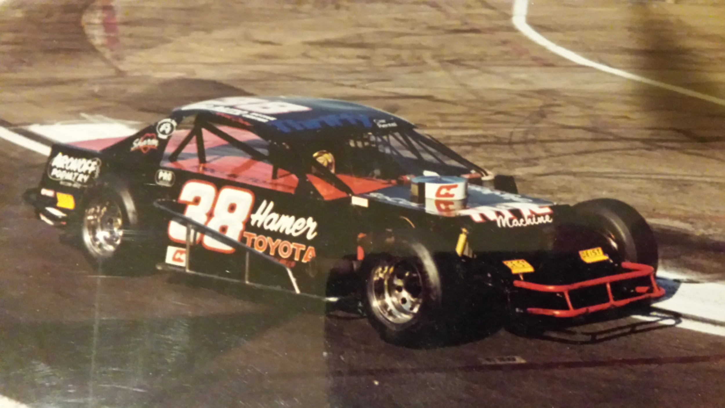 Rick Crow driving his number 38 Hamer Toyota, Aronoff Podiatry, Thrifty Rental Car, LADCO Leasing Modified 1994