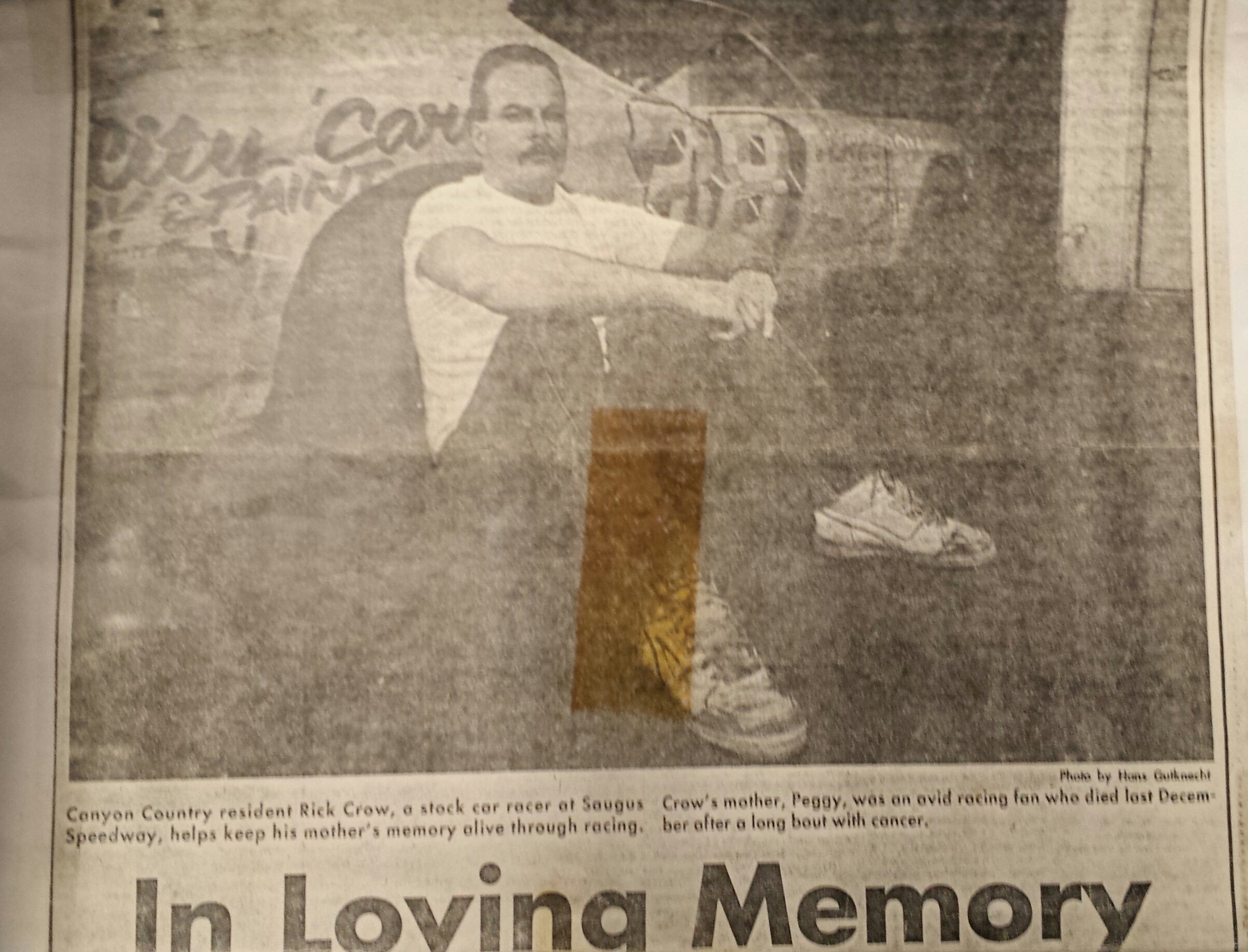 Newspaper clipping showing stock car racer Rick Crow beside a race car at Saugus Speedway, with a caption honoring his late mother, Peggy.