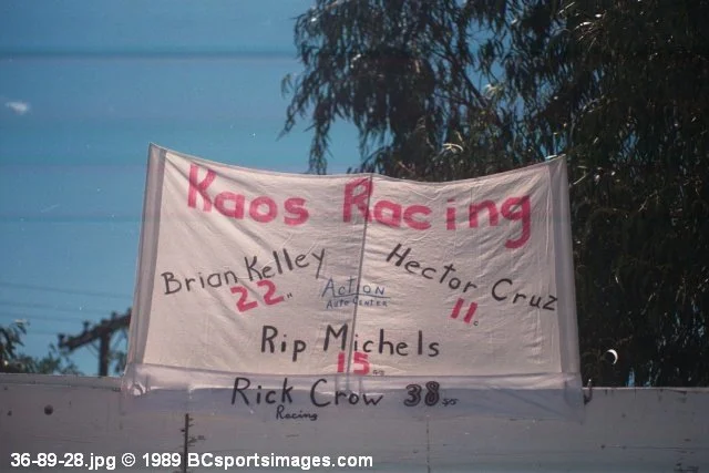 Handwritten “Kaos Racing” banner listing Brian Kelley, Hector Cruz, Rip Michels, and Rick Crow