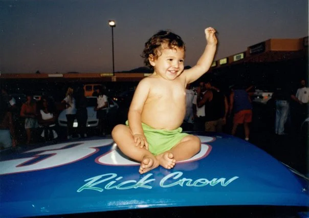 1992 Garrett Crow sitting on roof of Father Rick Crow Pro Stock race car