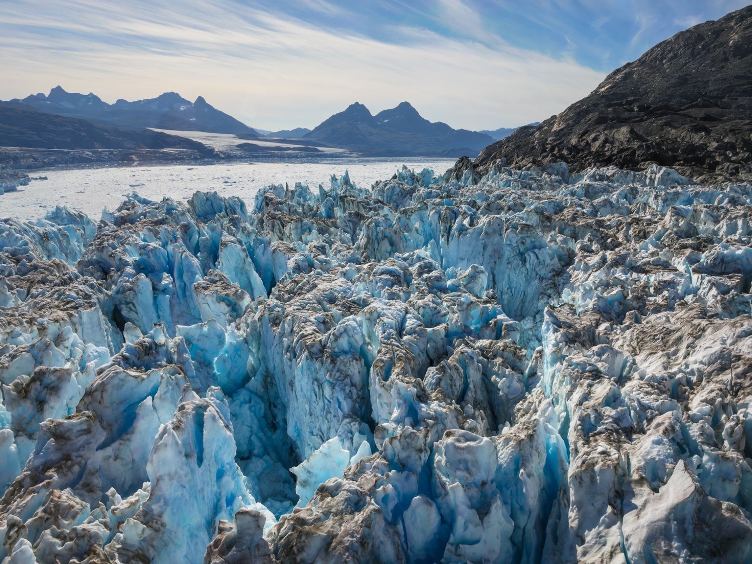 Glacier stretching across an Alaska mountain valley