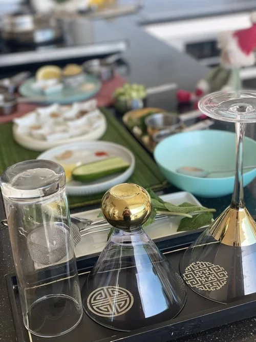 Glasses and cooking table for an online festive mocktail event
