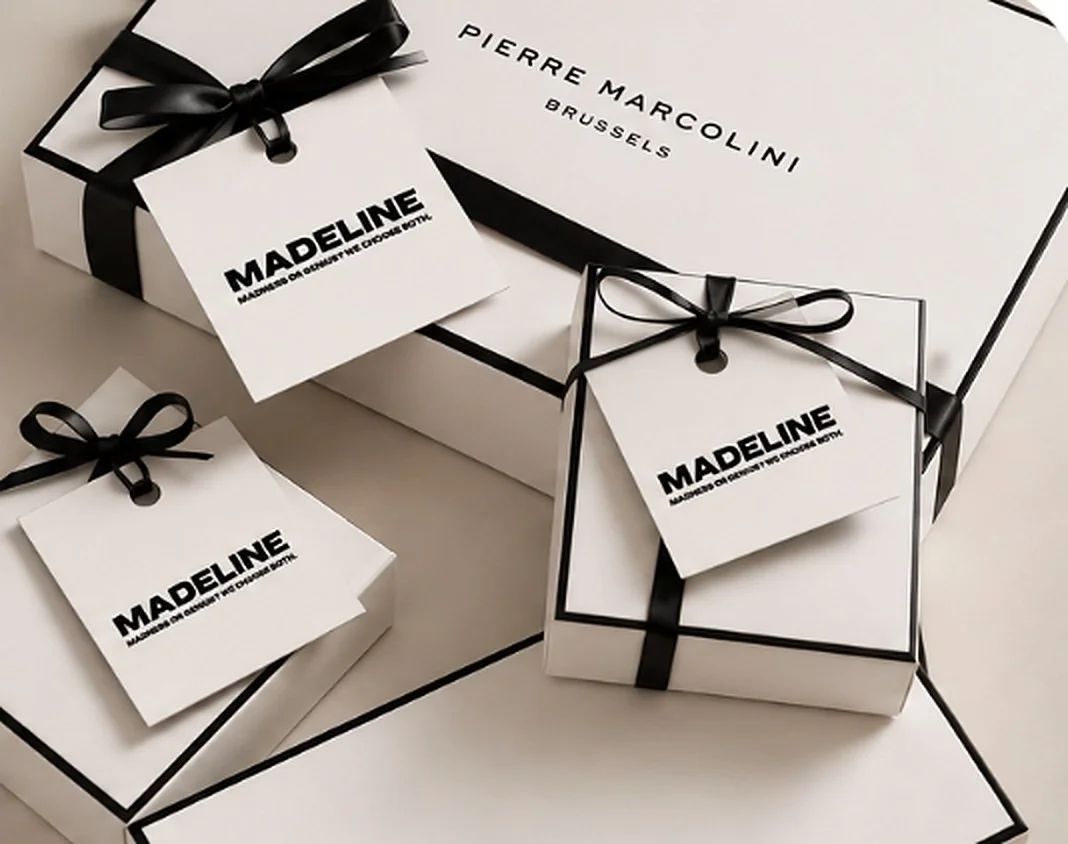 Gift boxes with black ribbons and Madeline tags