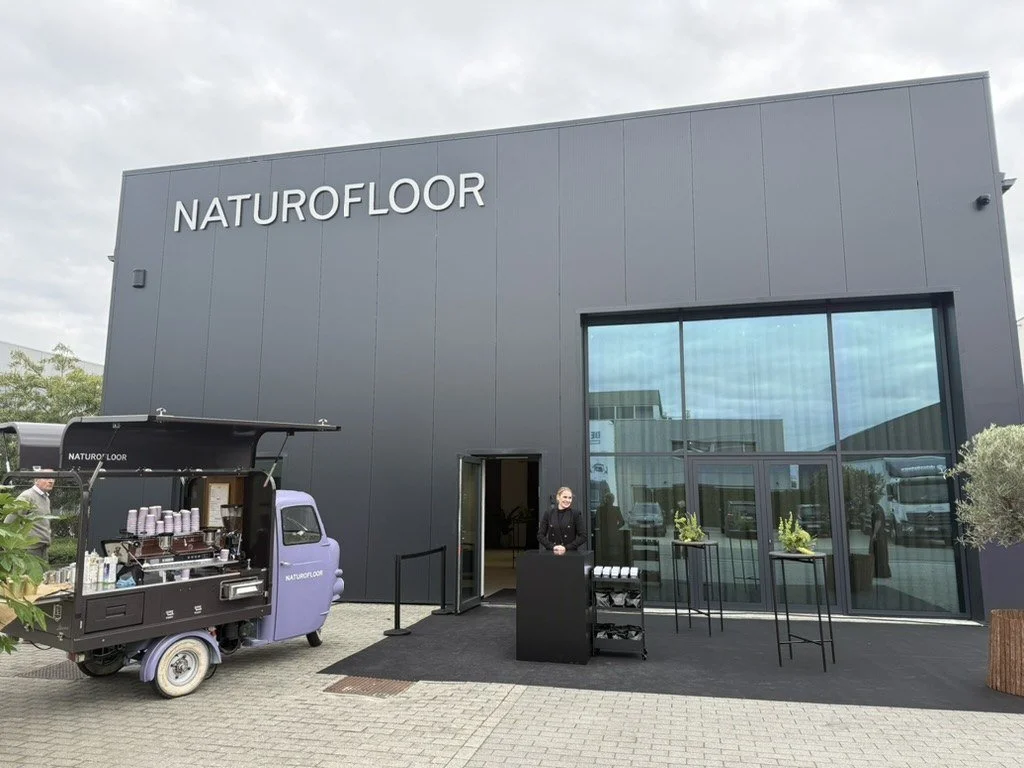 The new Naturofloor showroom with the espresso tuk-tuk and welcome desk at the entrance