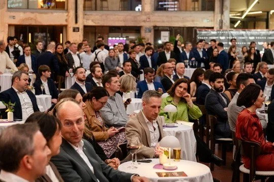 A full room of guests at the cocktail tables during the awards