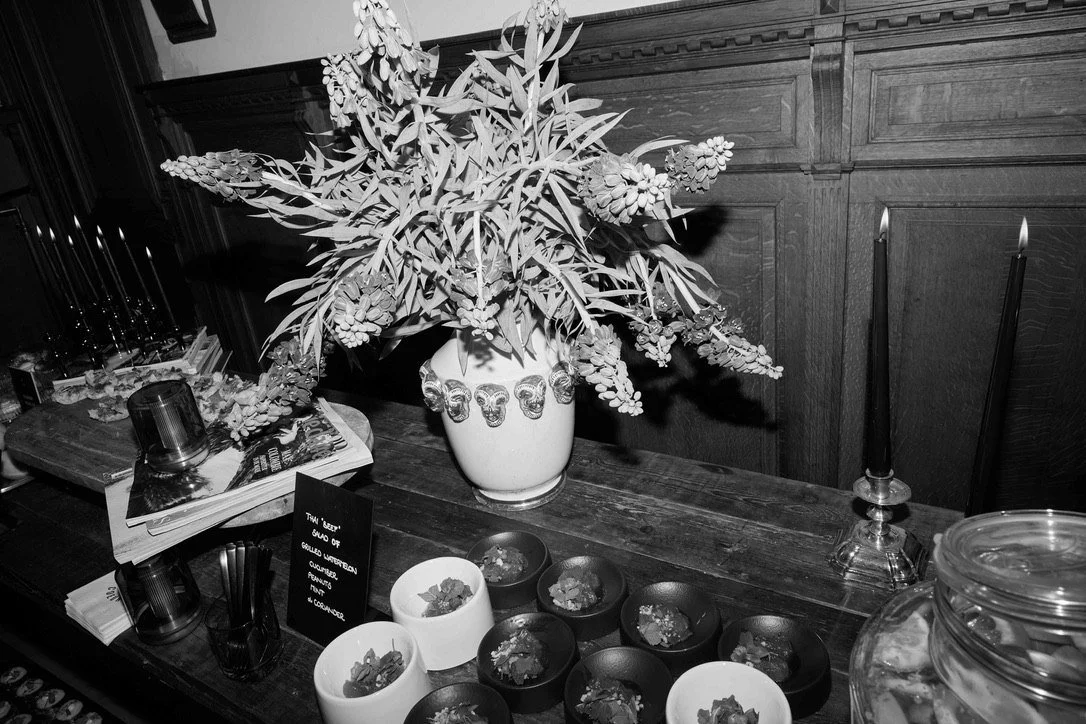 A bar with flowers, small bites and candles