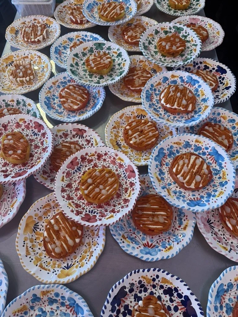 Starters plated on colourful hand-painted plates