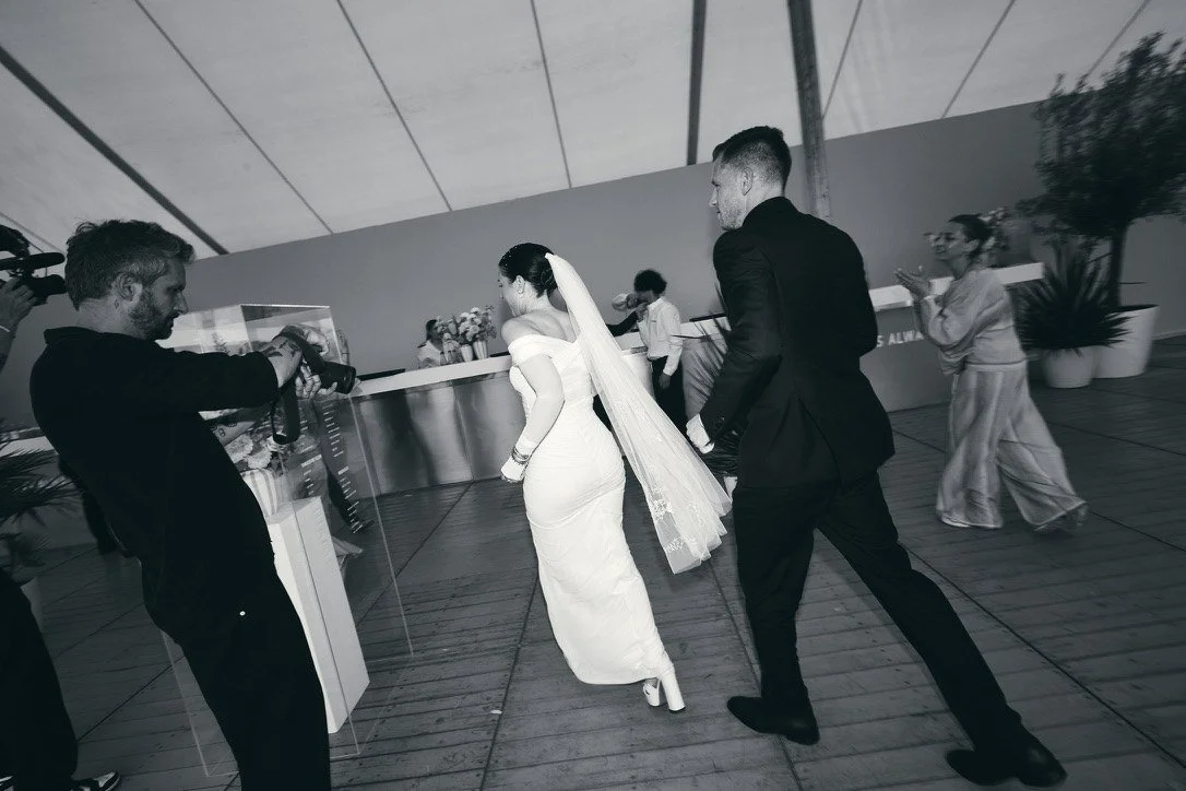 Black-and-white: the couple entering the tent