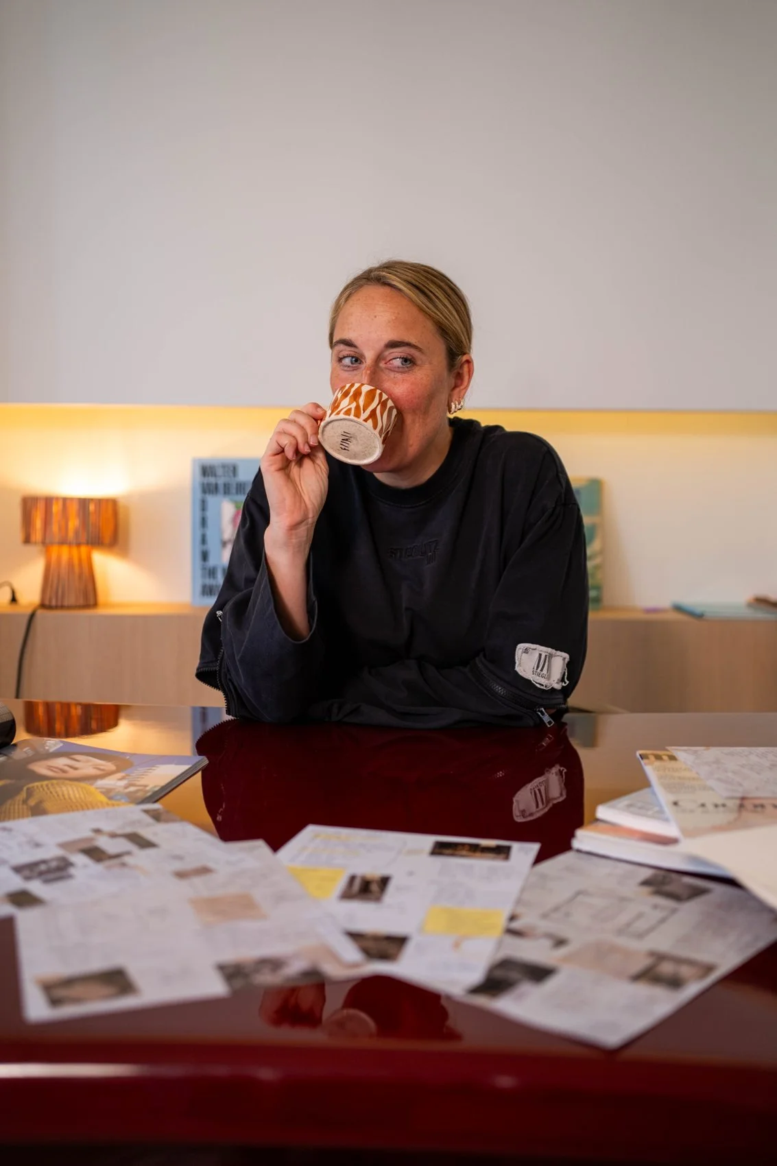 Emily at the lacquered desk in the Madeline studio