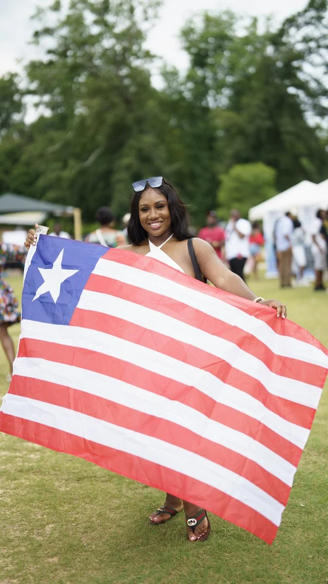 Guest carrying a Liberian flag at 1847Fest
