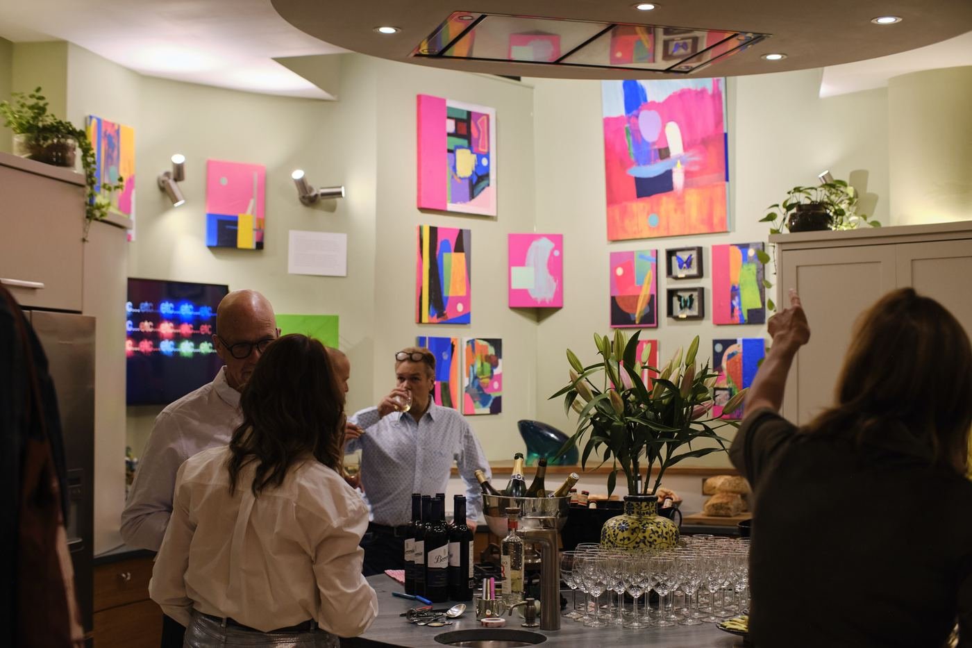 Guests in the kitchen at the private view